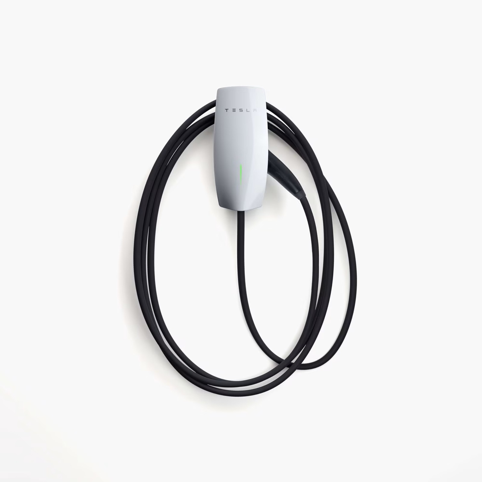 A Tesla wall connector installed on a wall